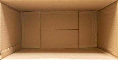 Open empty brown cardboard box background top view photo