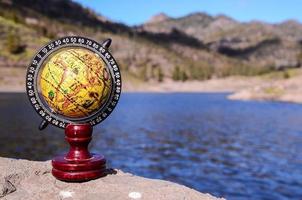 Globe on a rock photo