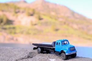 Toy car on a rock photo