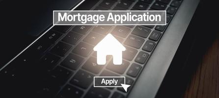 Home mortgage loan concept. Digital interface to Mortgage application with laptop photo as background. Contract for hire purchase and sale a house.