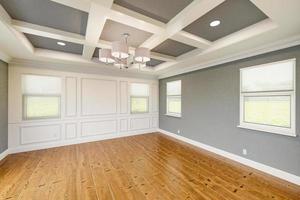 Beautiful Gray Custom Master Bedroom Complete with Entire Wainscoting Wall, Fresh Paint, Crown and Base Molding, Hard Wood Floors and Coffered Ceiling photo