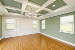 Beautiful Light Green Custom Master Bedroom Complete with Entire Wainscoting Wall, Fresh Paint, Crown and Base Molding, Hard Wood Floors and Coffered Ceiling photo