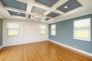 Beautiful Blue-Gray Custom Master Bedroom Complete with Entire Wainscoting Wall, Fresh Paint, Crown and Base Molding, Hard Wood Floors and Coffered Ceiling photo