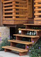 Exterior wooden stairs to house entrance photo