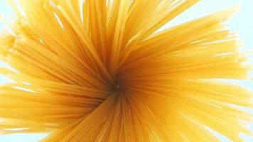 Close-up of spaghetti noodles being cooked in boiling water in a pot. video