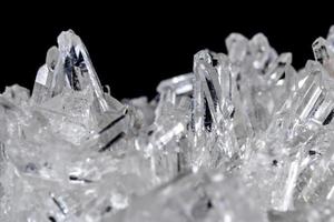 Macro Mineral Stone Rhinestone in Crystals on a Black Background photo