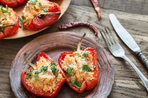 Stuffed red bell peppers with white rice and cheese photo