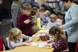 Belarus, the city of Gomil, December 28, 2019. The library is central. Children draw at the table. photo