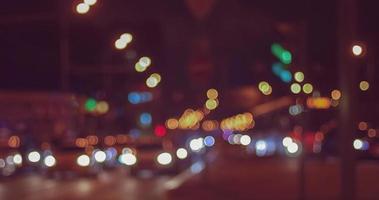 Blurry traffic lights of night city, dark blurred cityscape photo