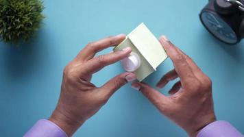 Man open a cap of milk container top view video