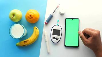 diabetic measurement tools and insulin pen, milk and fruits video