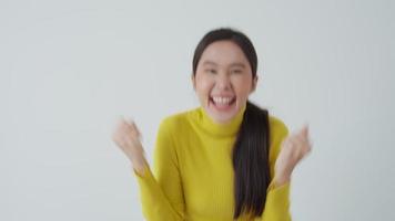 Asian beautiful woman exited surprise face expression . female feels shocked with the phone. exciting smile and happy adorable rejoices. Very enjoy and fun relax time. wow, video