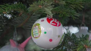 Christmas tree with 24 ball decoration - close shot video
