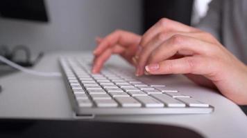 Woman office worker typing on the keyboard video