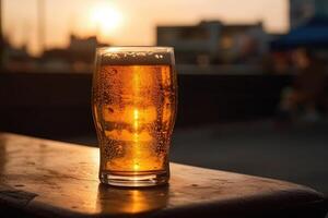 Glass of beer on a table in a bar on blurred bokeh background photo