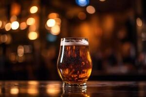 Glass of beer on a table in a bar on blurred bokeh background photo