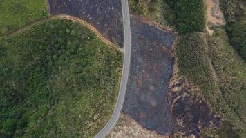 Mountain destroyed by human for cultivate plants. Aerial view of mountains covered in haze from burning forests. Areas with dense smog and covered with PM2.5. Air pollution and ecological problems video