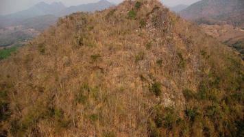 Mountain destroyed by human for cultivate plants. Aerial view of mountains covered in haze from burning forests. Areas with dense smog and covered with PM2.5. Air pollution and ecological problems video