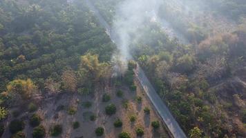 Mountain destroyed by human for cultivate plants. Aerial view of mountains covered in haze from burning forests. Areas with dense smog and covered with PM2.5. Air pollution and ecological problems video