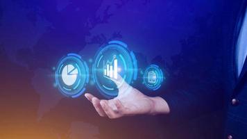 Big data analytics and business intelligence BI concept with chart and graph icons on digital screen interface and business people in the background. photo