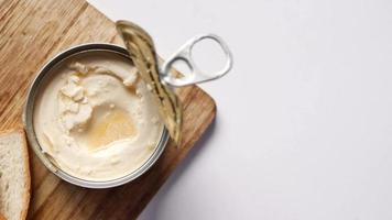 top view of milk cream in a container on table . video