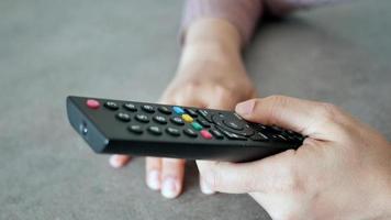 close up of man hand holding tv remote video