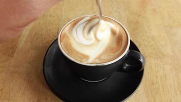 Cup of a coffee on wooden table video