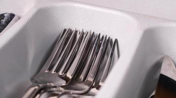 cutlery fork with knife and spoon in a drawer , video