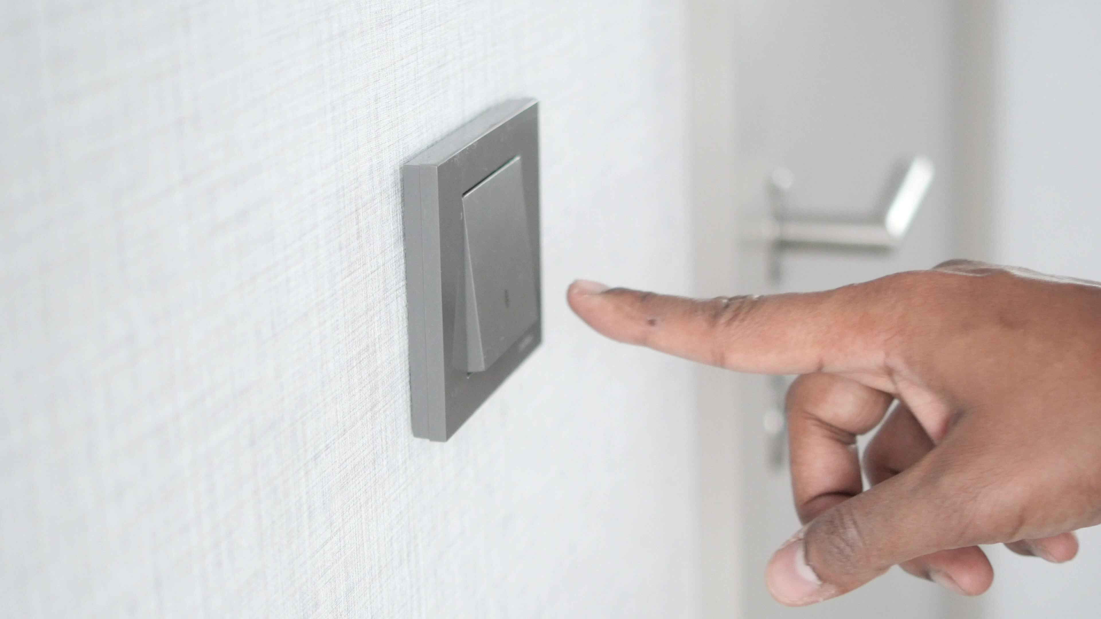 Close up of person hand wiping light switch 22169822 Stock Video at
