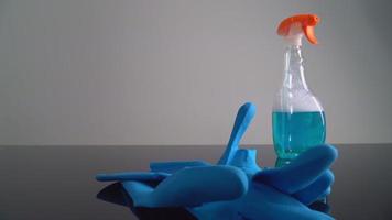 Rubber gloves and cleaning solution Placed on the table video