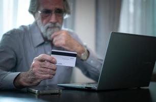 An elderly man experiencing financial difficulties. due to lack of saving during working age and no children to support photo