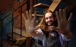 Pottery artist, Young making a piece of clay molding calmly and meticulously In order to produce the most attractive work possible, photo