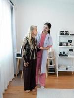 Caregiver for an elderly woman Weekly check-ups at the patient's residence. Ready to give medical advice and talk about various stories, exchange each other happily. photo