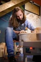 Pottery artist, Young making a piece of clay molding calmly and meticulously In order to produce the most attractive work possible, photo