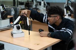 Students studying robotic hand technology are learning how to construct robotic hands for a range of industrial uses. photo