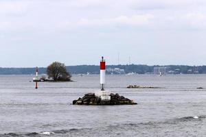 A lighthouse is a navigational landmark that is used to identify coasts and locate ships. photo