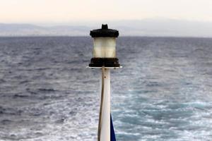 A lighthouse is a navigational landmark that is used to identify coasts and locate ships. photo