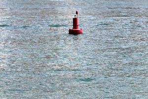 A lighthouse is a navigational landmark that is used to identify coasts and locate ships. photo