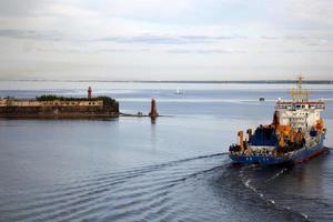 A lighthouse is a navigational landmark that is used to identify coasts and locate ships. photo