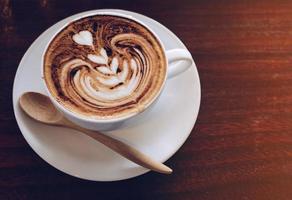 A cup of hot Mocha coffee on wooden table. photo