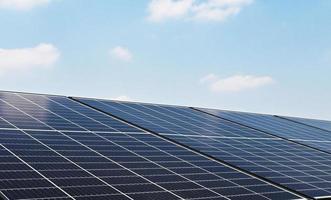 solar cell panel with blue sky. energy cleaning in nature concept photo