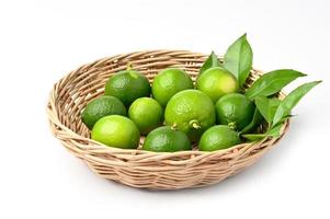 fresh lime in basket isolate on white background photo