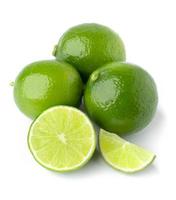 three lime with half slice isolate on white background photo