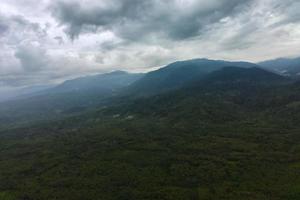 aerial view beautiful morning view from Indonesia about mountain and forest photo