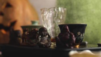 small buddha figurine for chinese tea ceremony. tea set for making tea video