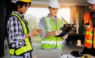 colleagues discussing data working and tablet, laptop with on on architectural project at construction site at desk in office photo