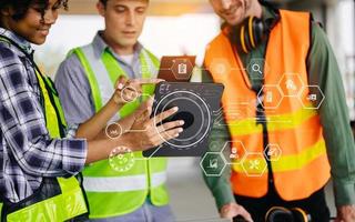 colleagues discussing data working and tablet, laptop with on on architectural project at construction site at desk in office photo