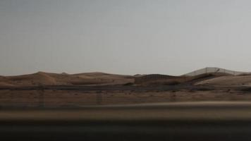 View From Car Driving Through. Middle Eastern Desert In United Arab Emirates video