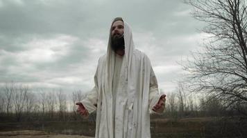 A Man In White Robes With Hood, Shroud Teaching, Preaching video