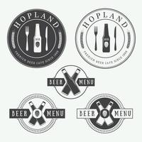 Set of vintage beer and pub logos, labels and emblems with bottles, hops, and wheat vector